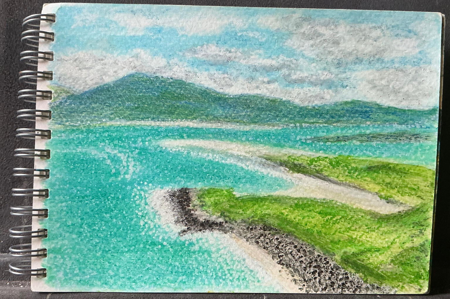 For my second attempt on the postcard sized art pad I chose a Scottish seascape. Again I used watercolour pencils.